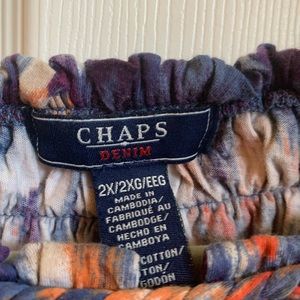 An adorable blouse, colorful but not not loud. Elastic arms.